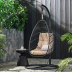 Chaise suspendue pliable d'extérieur Coloma en osier et corde avec support