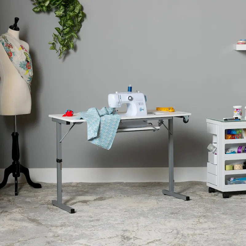 II Table de couture argent/blanc pliable portative à roulettes
